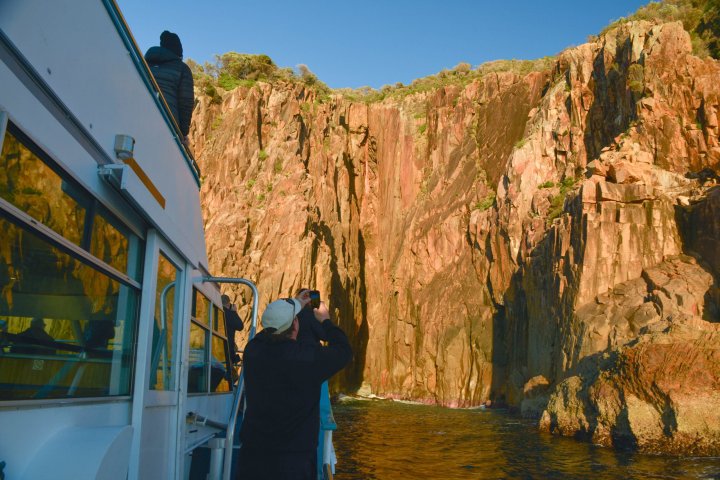 a person standing in front of a mountain