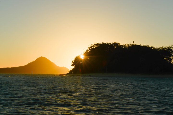 a sunset over a body of water