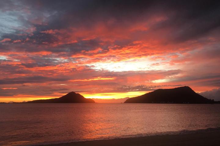 a sunset over a body of water