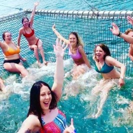 a group of people in a pool of water