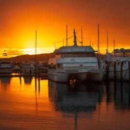 a boat docked at sunset