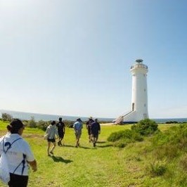 a group of people standing in a field