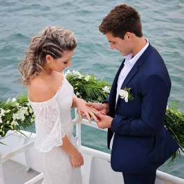 a person standing next to a body of water