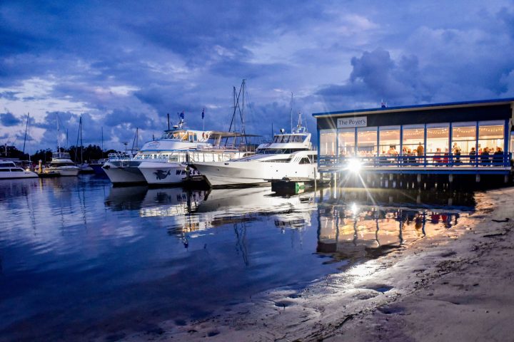 a boat is docked next to a body of water