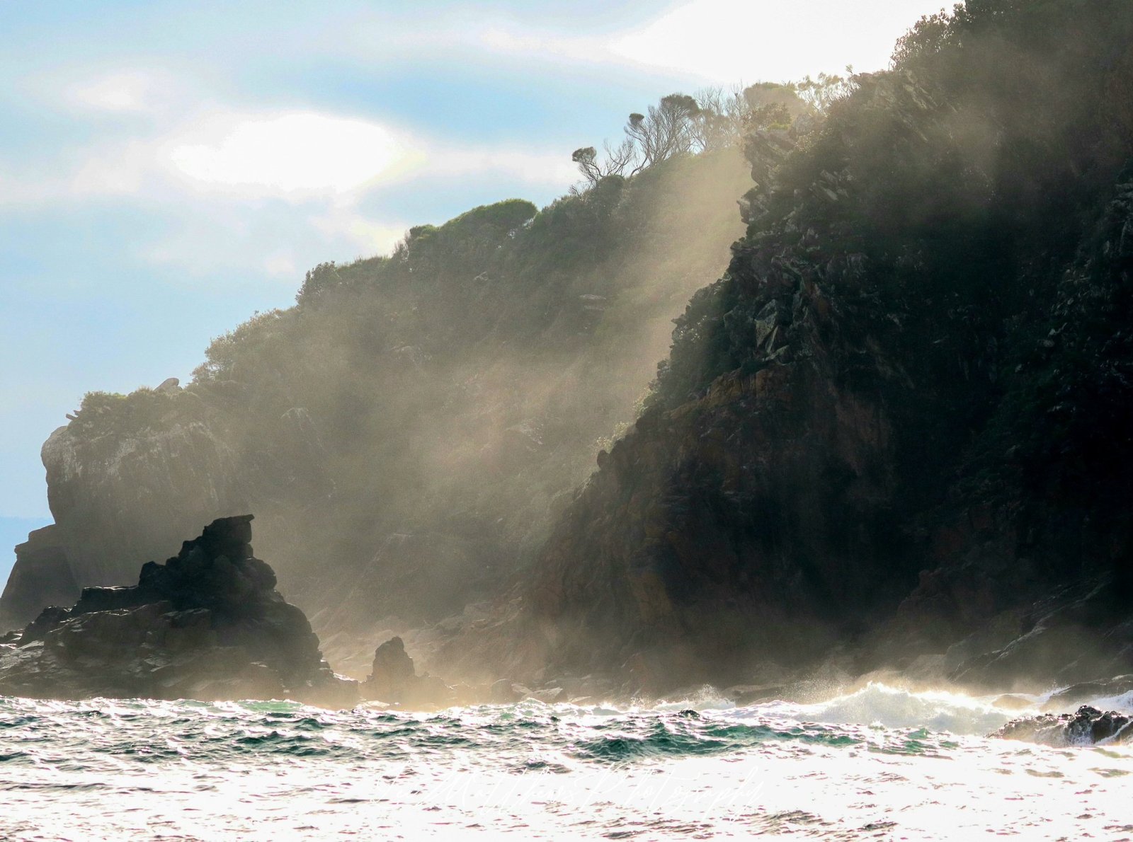 a person riding a wave on top of a mountain
