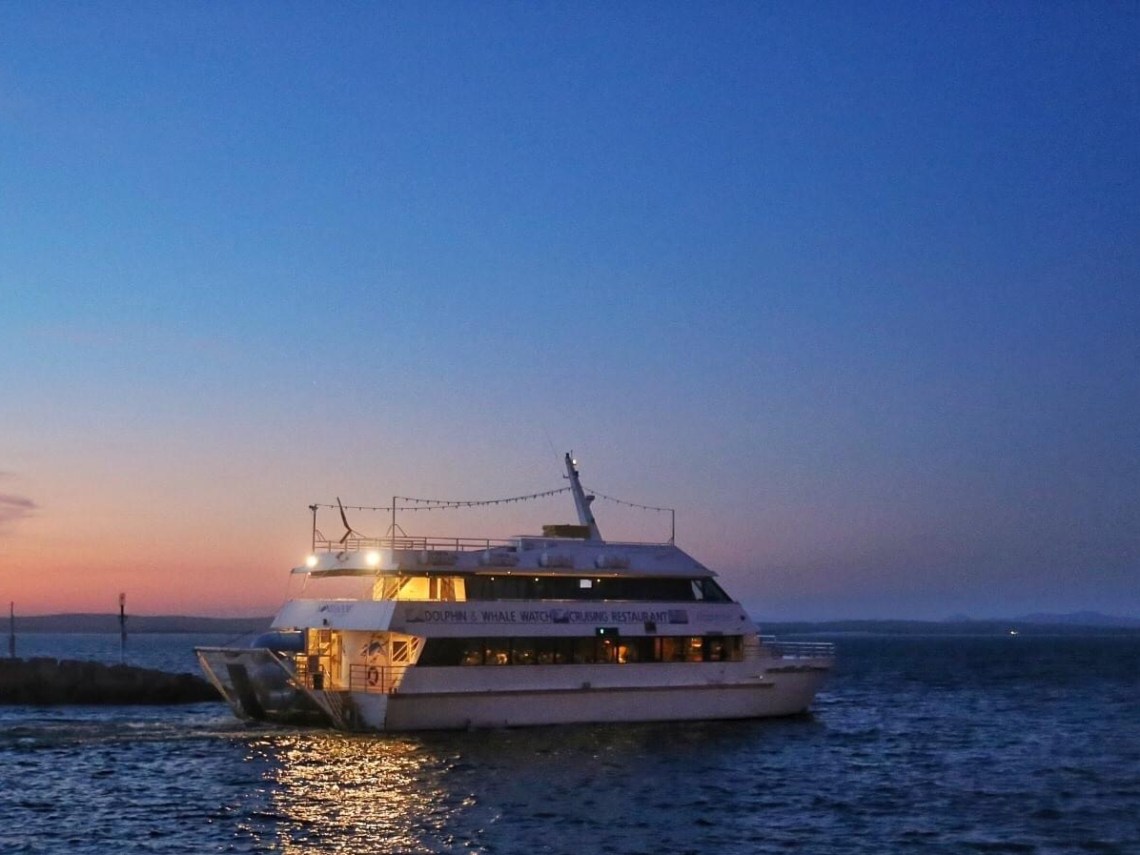 a small boat in a large body of water