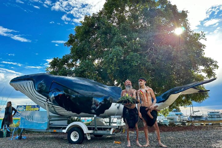 a group of people riding on the back of a truck